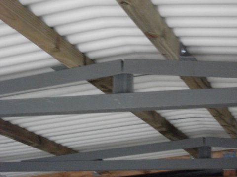 fairford Concrete garage with Interlocking concrete panels inside the garage looking at the uPVC roofing