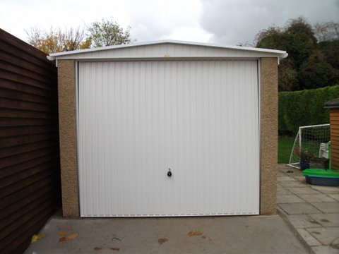 fairford Concrete garage with Interlocking concrete panels Up and Over door